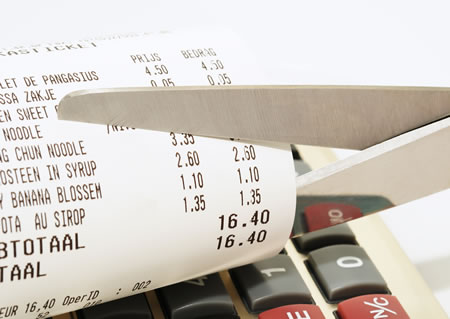 stock-photo-economy-concept-with-scissors-cutting-receipt-from-shop-63461440